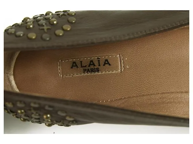 Alaïa Alaia Bailarinas con tachuelas en tono latón y cuero marrón Bailarinas 36.5 Castaño 